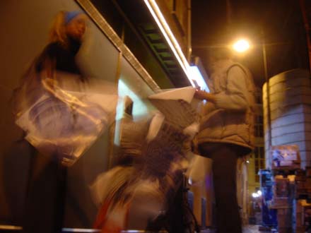 People taking Inside posters